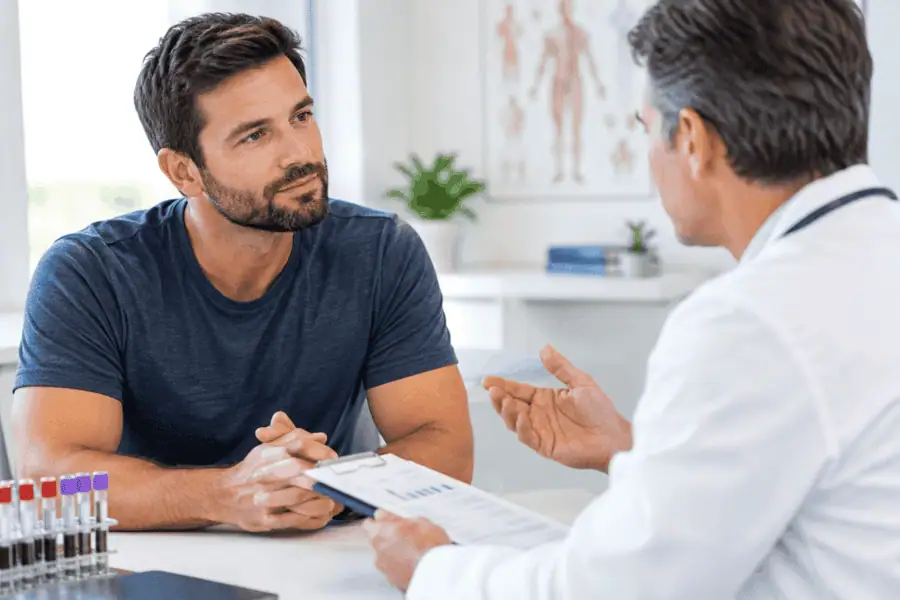 A male patient discussing testosterone replacement therapy (TRT) options during a medical consultation with a healthcare provider at Incite Health and Wellness in Peoria, AZ.